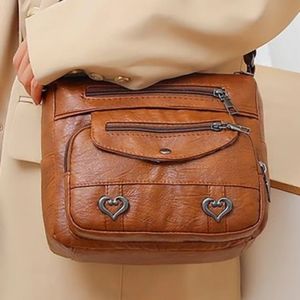 Wabtum's Heart Accent Series, multi pocket, leather, magnetic snap & zippers.